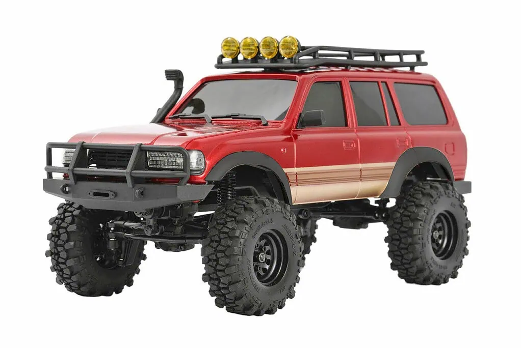 RC off-road vehicle with large tires and rugged design for scale model enthusiasts.