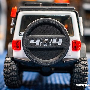 Spare tire cover for 4x4 RC models, designed for Axial SCX30, enhancing realism and protection.