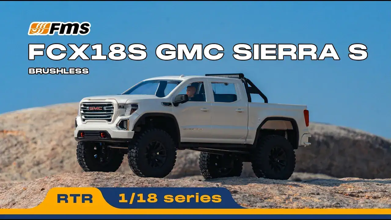 RC GMC Sierra S off-road vehicle in desert terrain.